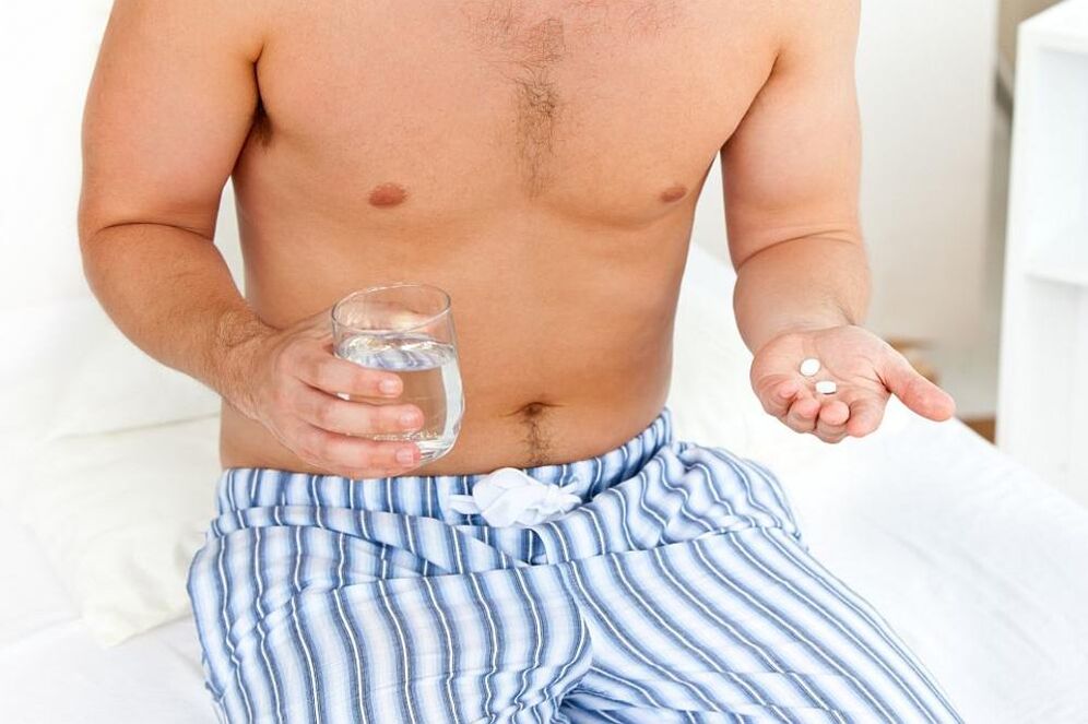 man takes pills for prostatitis